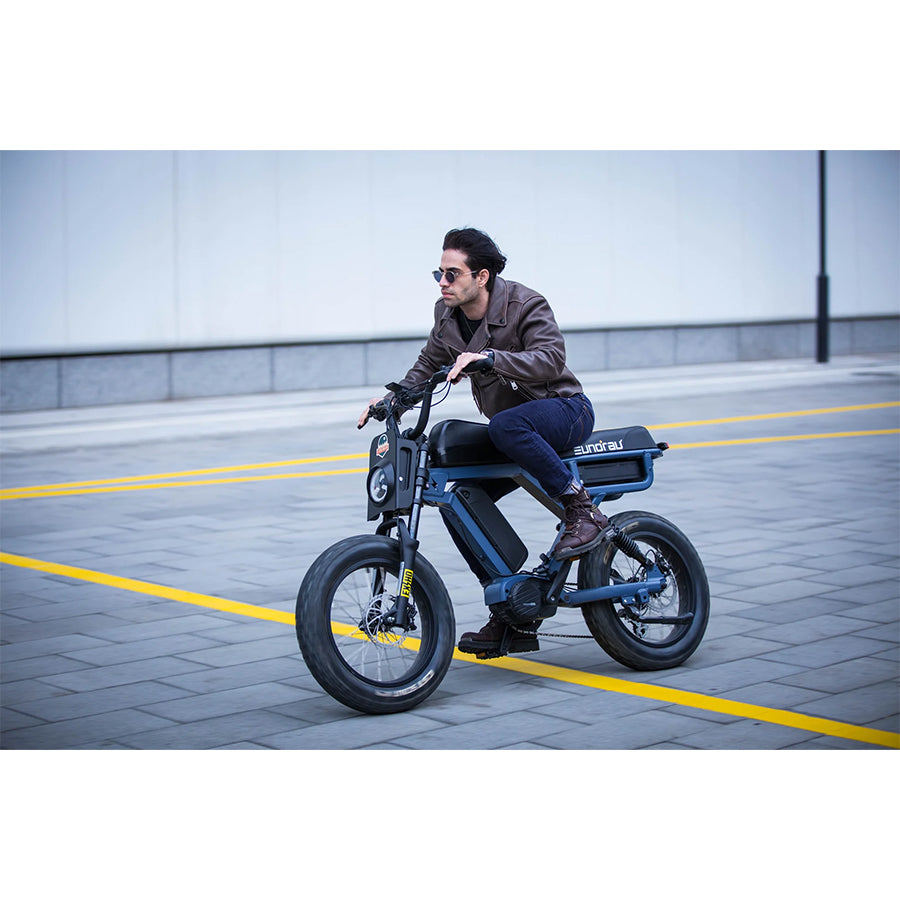 Person riding blue Eunorau Flash e-bike