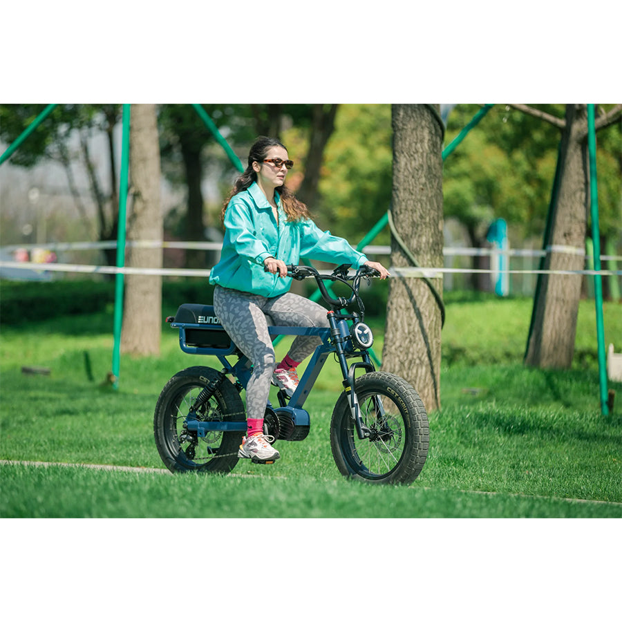 Woman riding Eunorau Flash e-bike in park