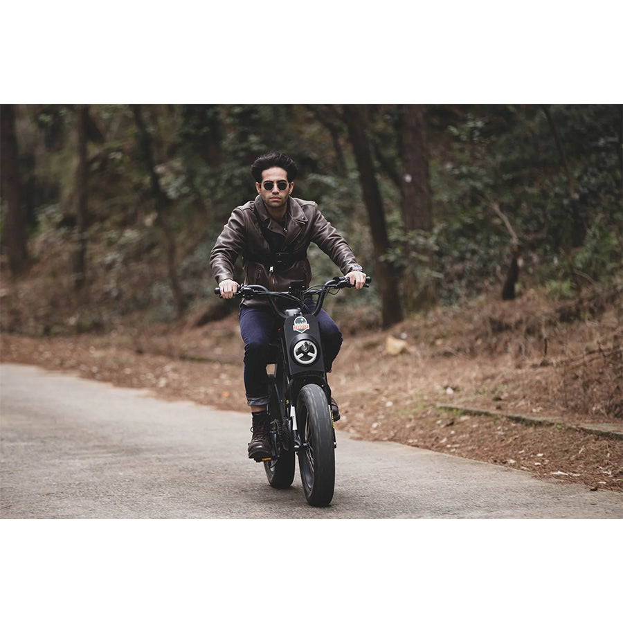 Person riding Eunorau Flash e-bike on road