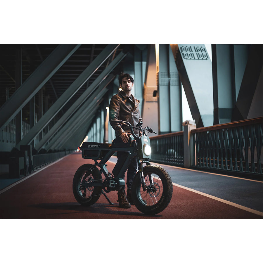 Person with Eunorau Flash e-bike on bridge