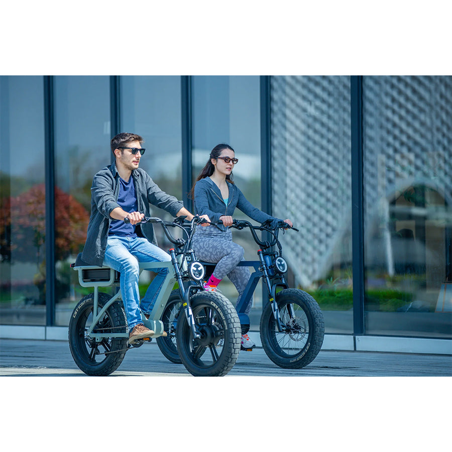 Two people riding Eunorau Flash e-bikes