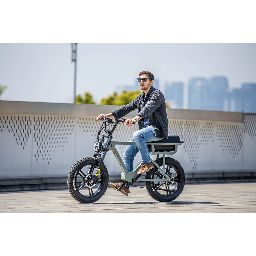 Person riding Eunorau Flash e-bike on rooftop