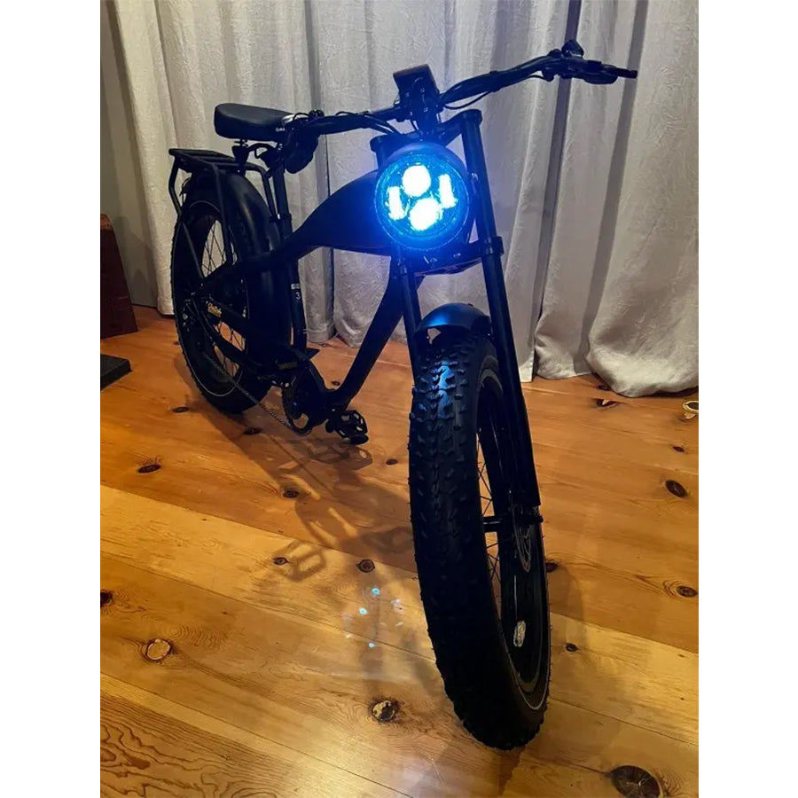 Black bike variant with front light on, front view
