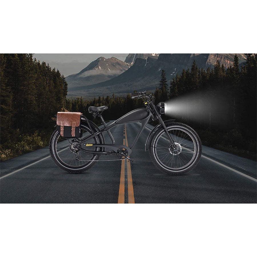 Black bike with front light on and saddle bag on the rear rack